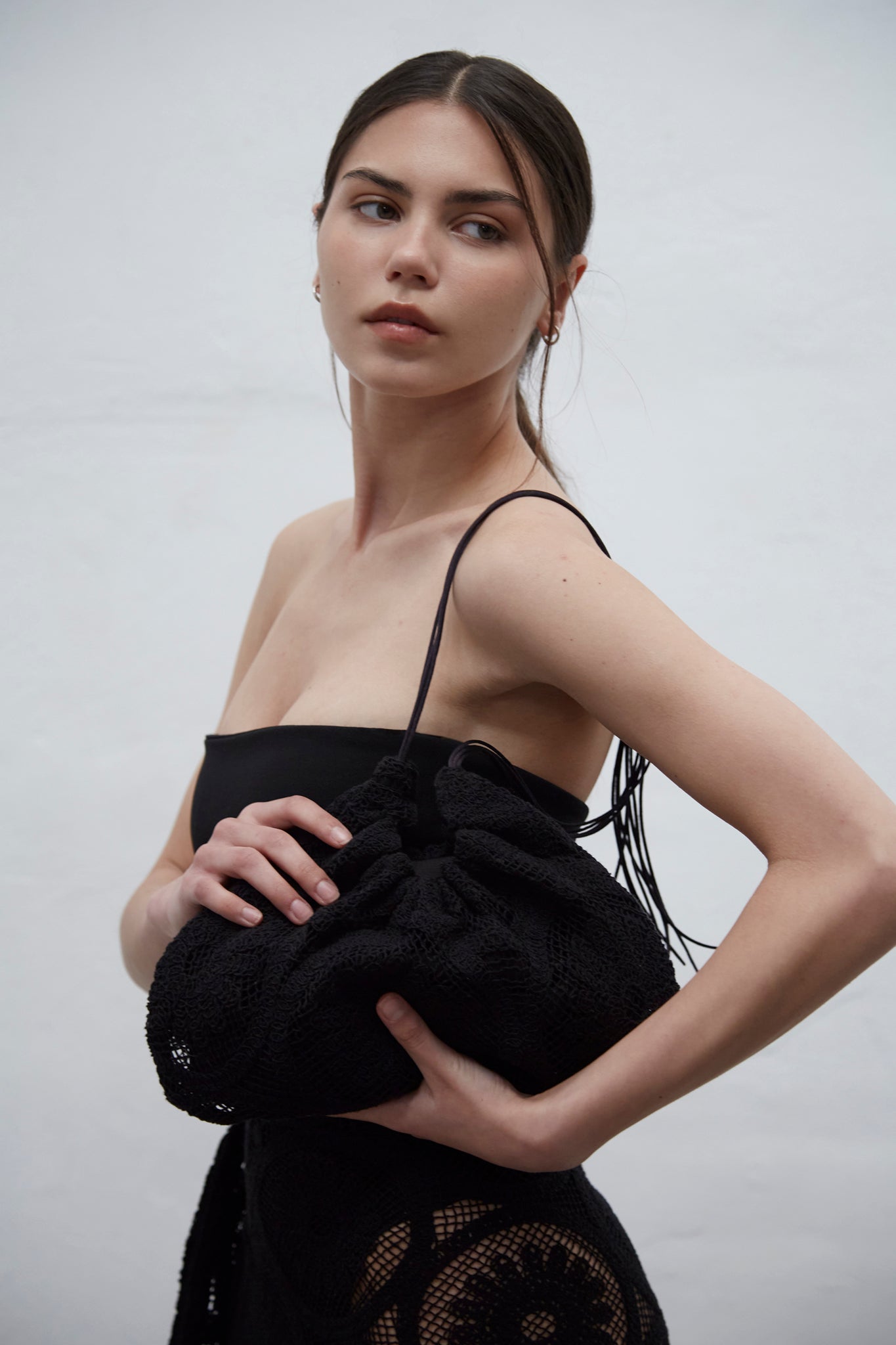 Clau black guipure crochet bag with gathered silhouette and cotton ties, handmade in Barcelona