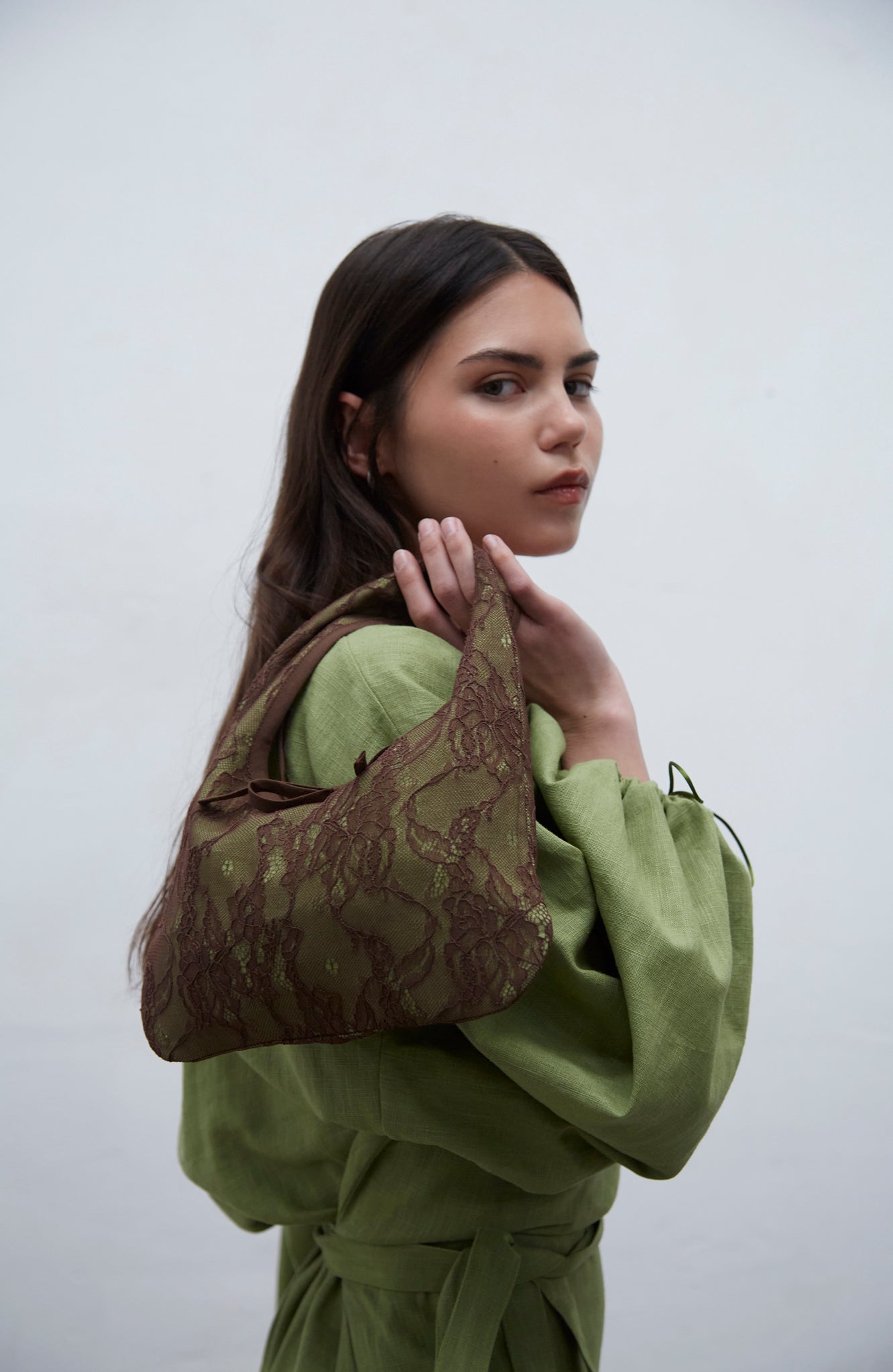 Lisa kiwi green linen bag with delicate lace detailing and bias trim, handmade in Barcelona