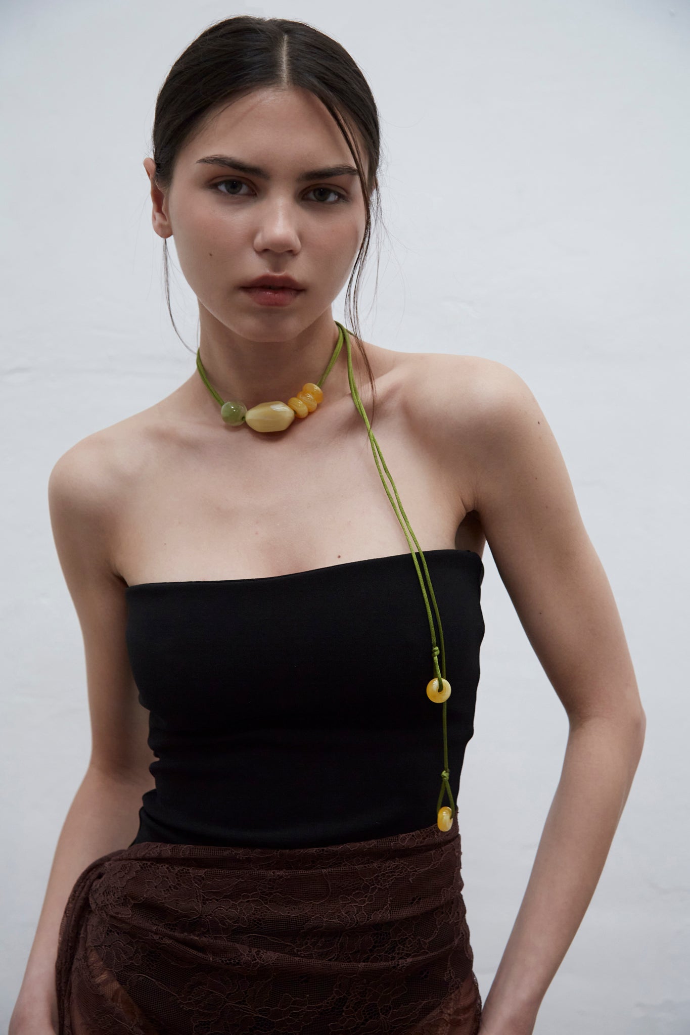 Lucy choker belt crafted from glossy resin, wearable as a necklace or waist accessory, handmade in Barcelona