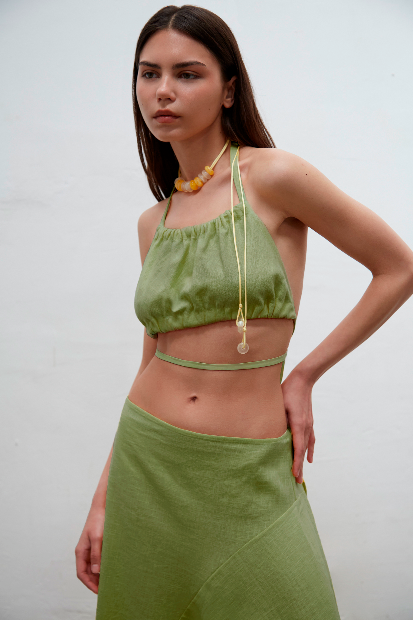Mila kiwi linen mini top with adjustable ties, one-size design for sizes S to L, handmade in Barcelona