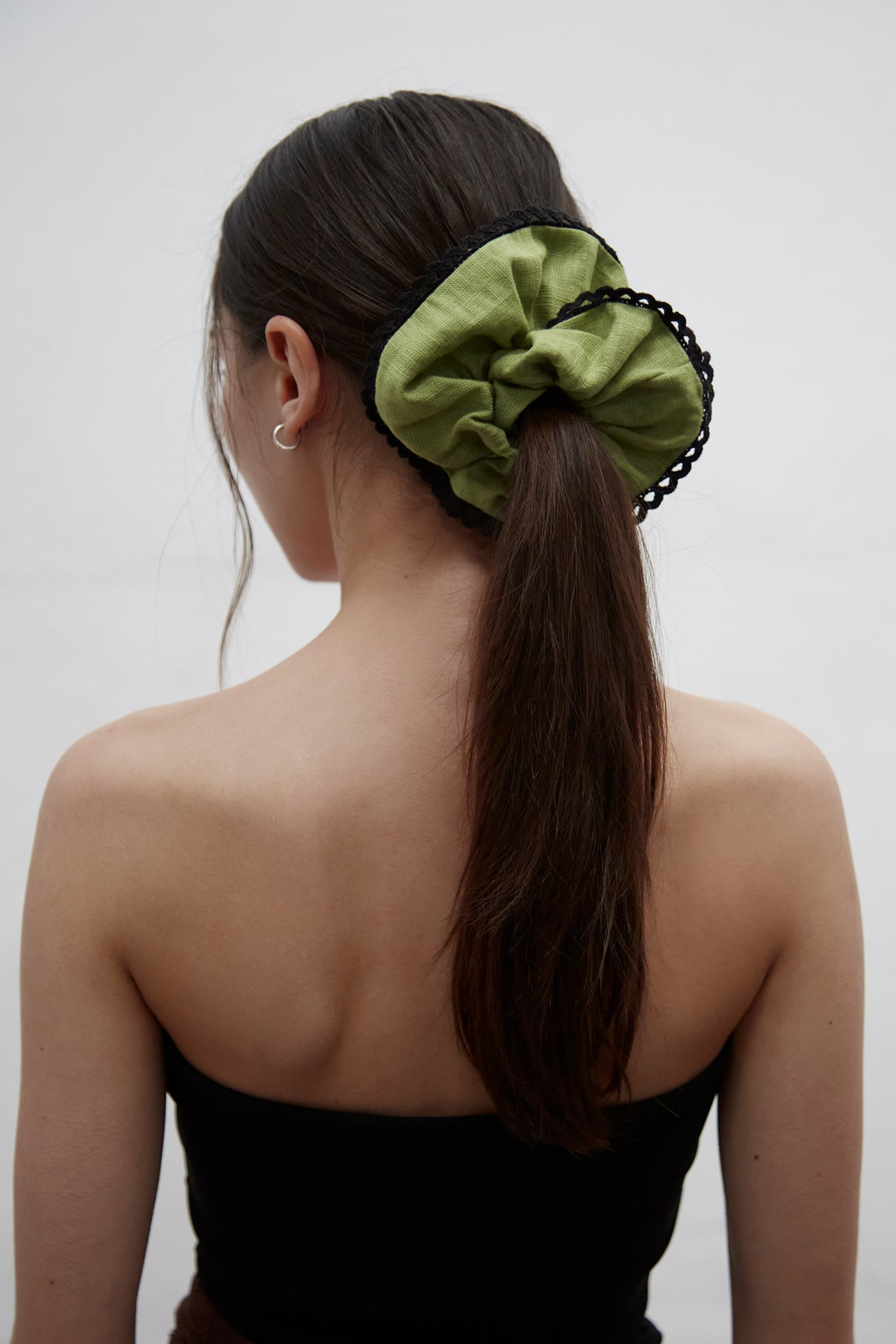 Sarah kiwi green linen scrunchie with decorative braid trim, handmade in Barcelona