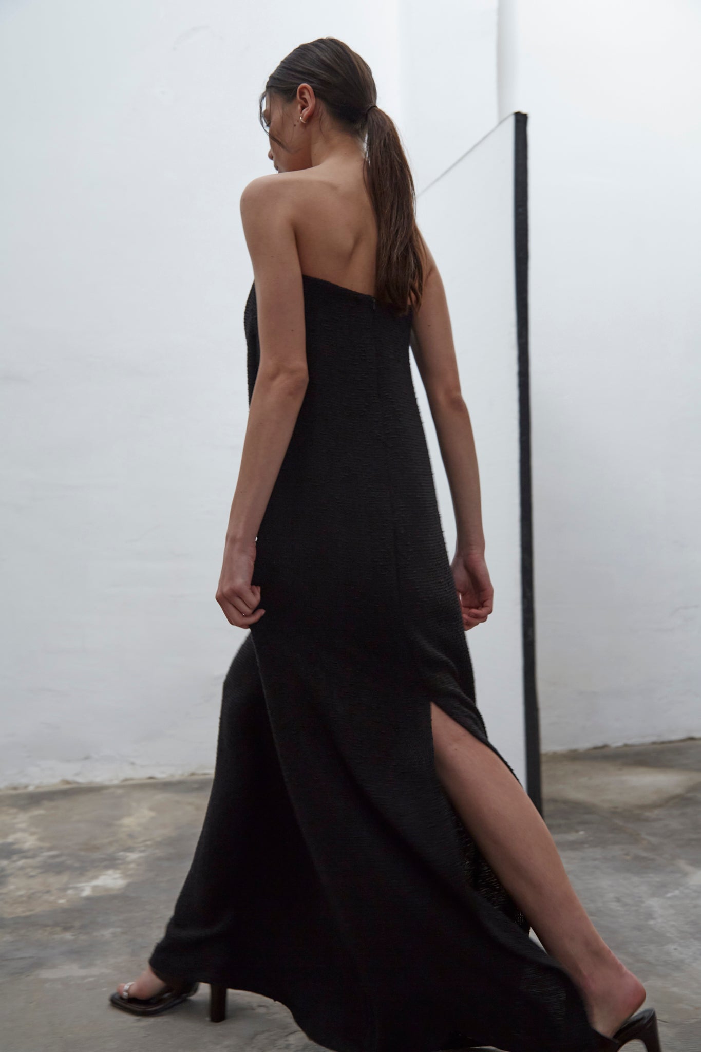 Bardot black strapless tweed dress with internal bustier and silicone bands for support, handmade in Barcelona